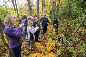 4-Hers in the woods at Bryant Pond learning about the environment